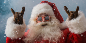 Santa Claus wearing sunglasses dancing outdoors at North Pole