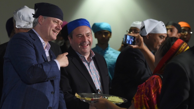 Harper to pledge funds to help new Canadians