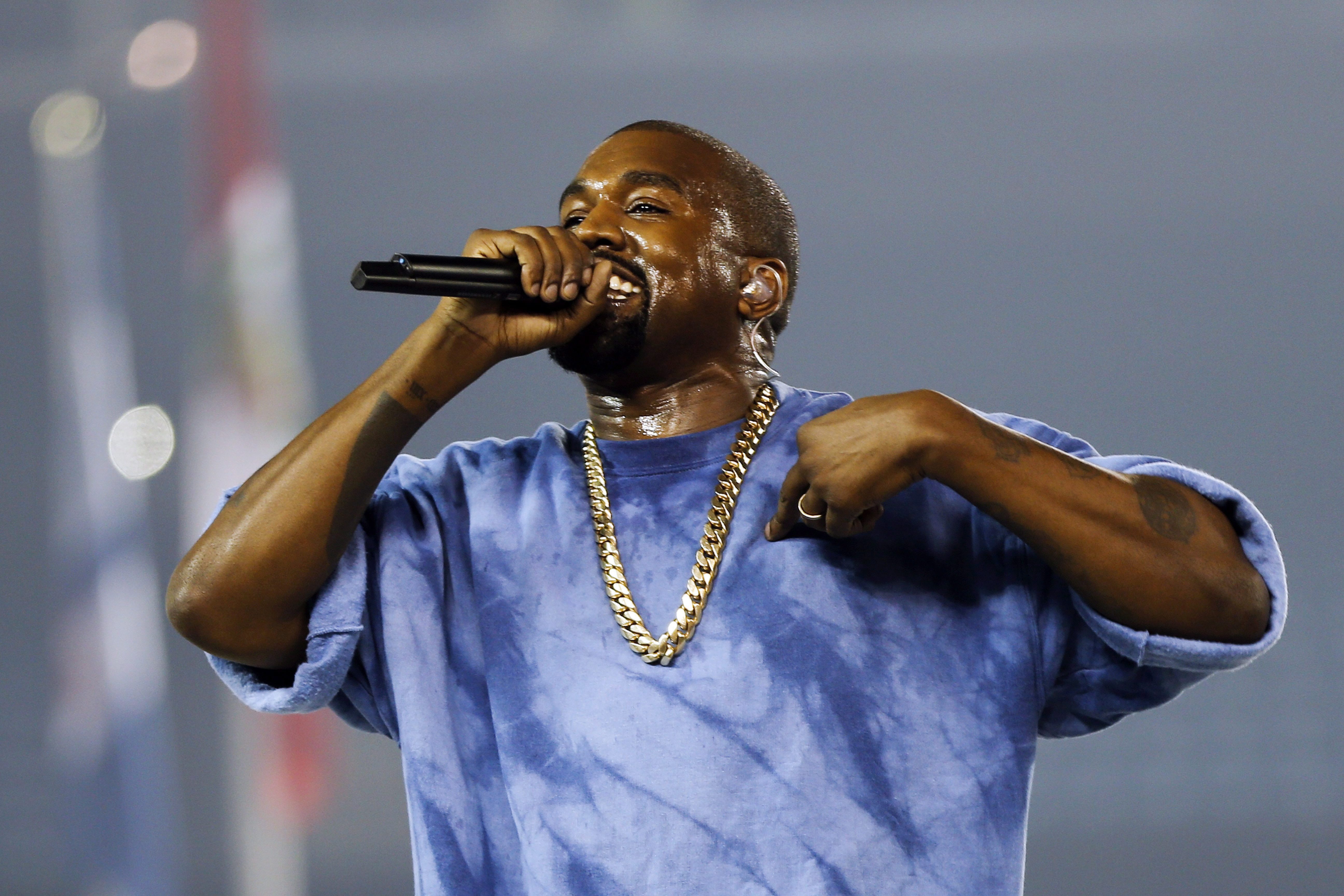 FILE - In this July 26, 2015, file photo, Kanye West performs during the closing ceremony of the Pan Am Games in Toronto. Kanye West, Beck, the Strokes and the Killers are set to perform at the three-day 2016 Governors Ball Music Festival in June.  (AP Photo/Julio Cortez, File)