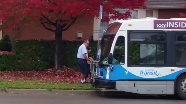 bus-driver-helping-woman