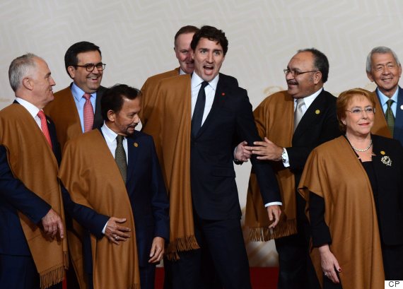 Canadian Prime Minister Justin Trudeau jokes around with fellow APEC leaders as they take part in the official family photo at the APEC Summit in Lima, Peru, on Sunday, Nov. 20, 2016. THE CANADIAN PRESS/Sean Kilpatrick