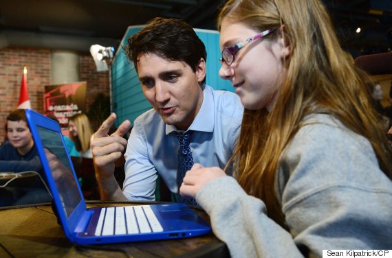 Prime Minister Justin Trudeau talks with grade 7 student Isabel Clement, 12, of D.A. Aubrey Intermediate as they take part in an Hour of Code event at Shopify in Ottawa on Monday, Dec. 5, 2016. THE CANADIAN PRESS/Sean Kilpatrick