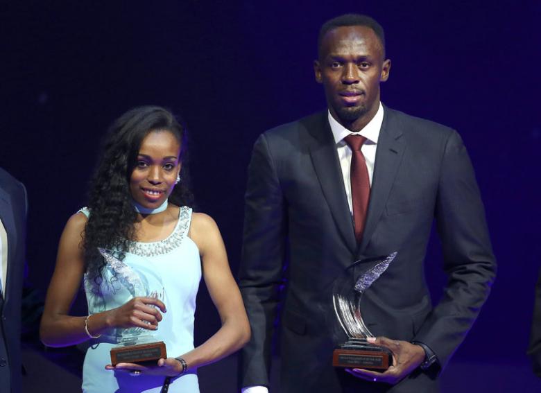 Usain Bolt of Jamaica (R) and Almaz Ayana of Ethiopia pose with their awards after being elected male and female World Athlete of the Year 2016 in Monaco, December 2, 2016.  REUTERS/Eric Gaillard